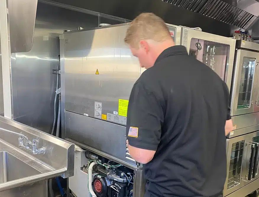 appliance repair technician at work
